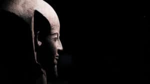 NGV's Pharaoh Exhibition depicting ancient relics from egypt. This photo shows a patron observing the didactic on the wall.